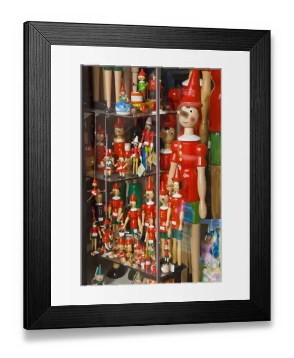Framed Print : Italy, Tuscany, Collodi. Pinocchio puppets in shop window Framed Print : Italy, Tuscany, Collodi. Pinocchio puppets in shop window