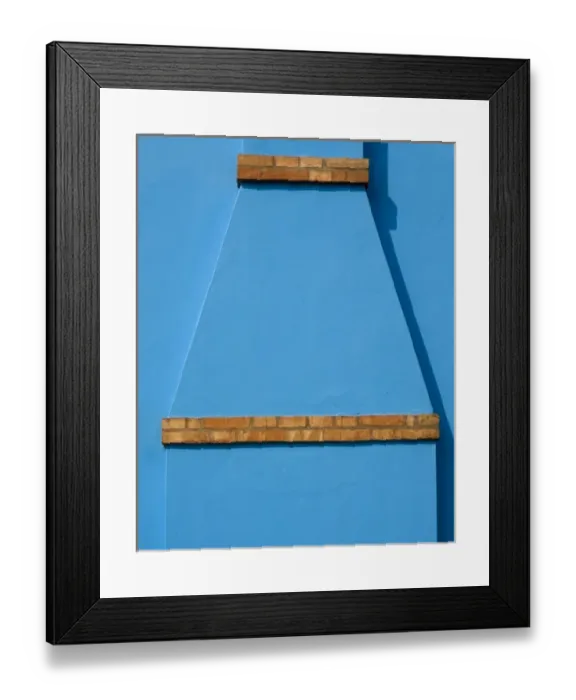 Framed Print : Italy, Burano. Blue stucco exterior of chimney and colored brick