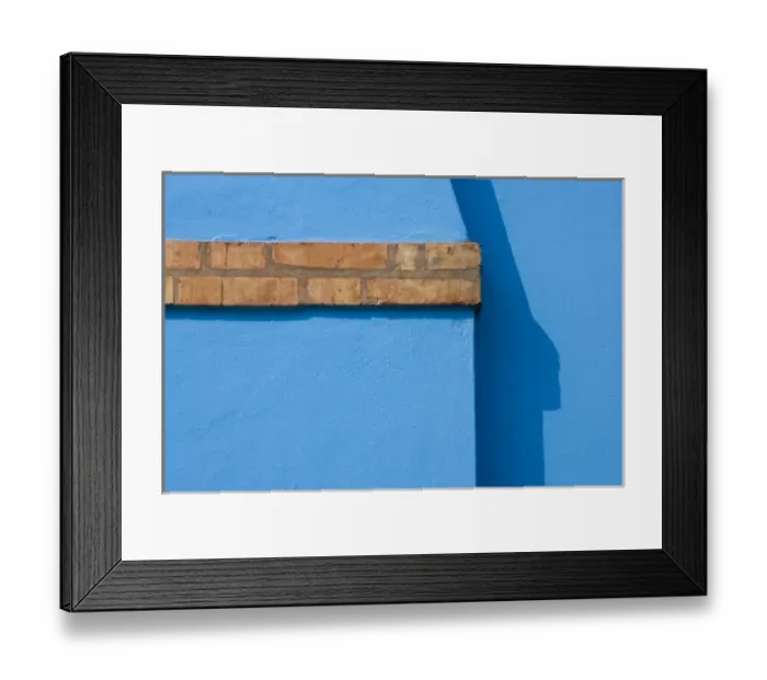 Framed Print : Italy, Burano. Close-up of blue stucco exterior of chimney and colored brick