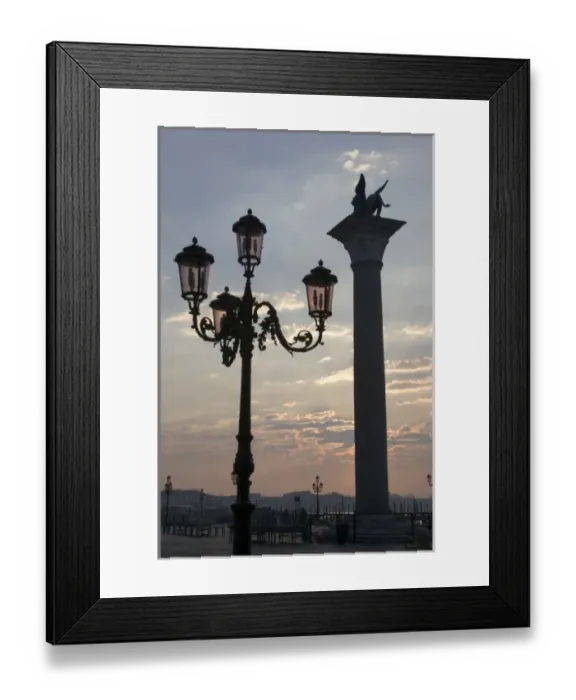 Framed Print : Italy, Venice. Lion of St. Mark atop column and ornate lamp at sunrise