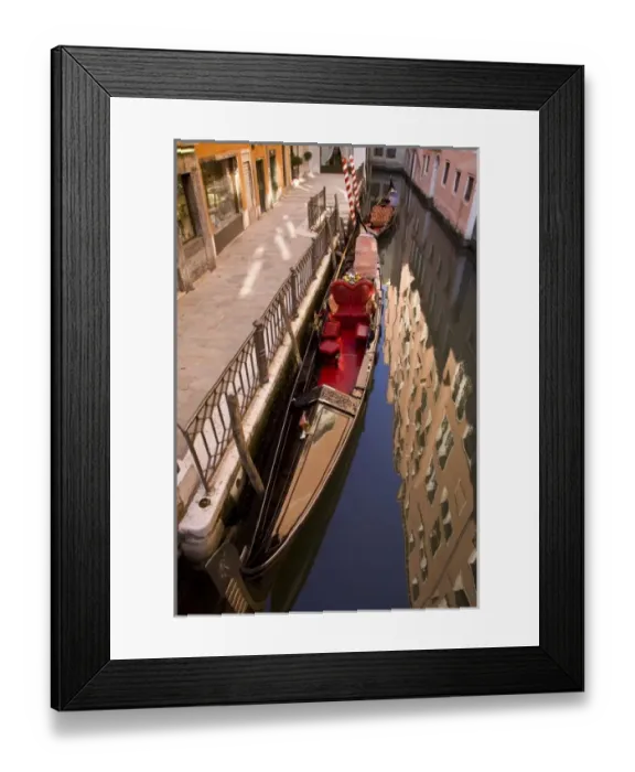 Framed Print : Italy, Venice. Gondola parked in a canal with building reflection Framed Print : Italy, Venice. Gondola parked in a canal with building reflection