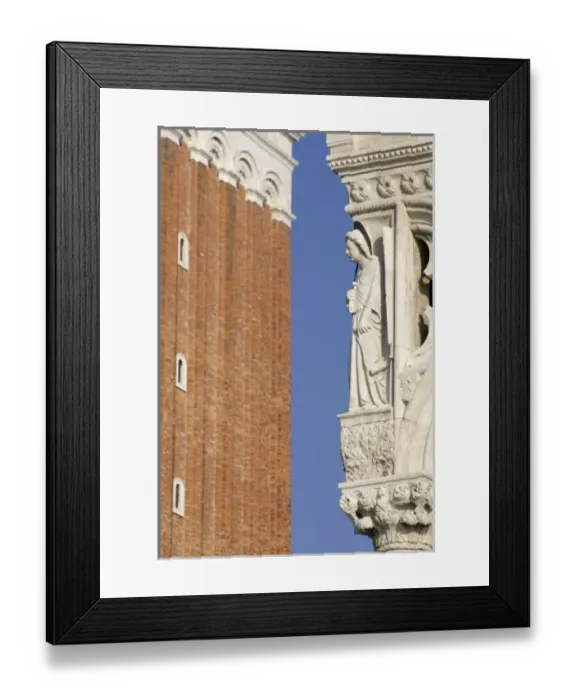 Framed Print : Italy, Venice. A statue on the corner of the Doges Palace with part of St. Mark s