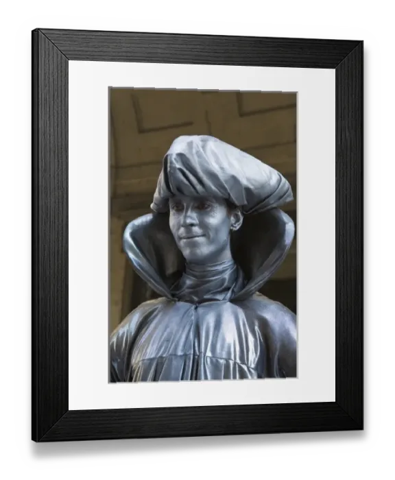 Framed Print : Italy, Florence. A mime in silver paint stands for a portrait