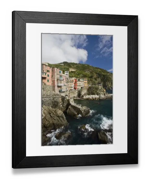 Framed Print : Italy, Cinque Terre, Riomaggiore. The village sits on cliffs above the sea Framed Print : Italy, Cinque Terre, Riomaggiore. The village sits on cliffs above the sea