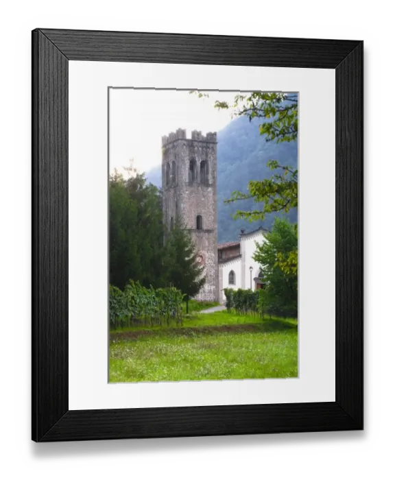 Framed Print : Bagni di Lucca, Tuscany, Italy - Grass lawn leading up to an old world church in a rural area Framed Print : Bagni di Lucca, Tuscany, Italy - Grass lawn leading up to an old world church in a rural area