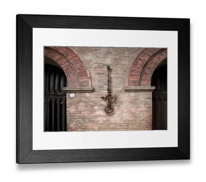 Framed Print : Bologna, Emilia-Romagna, Italy - An ornate iron ring is mounted on a brick wall Framed Print : Bologna, Emilia-Romagna, Italy - An ornate iron ring is mounted on a brick wall