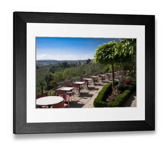 Framed Print : San Gimignano, Tuscany, Italy - High angle view of an outdoor dining terrace overlooking Framed Print : San Gimignano, Tuscany, Italy - High angle view of an outdoor dining terrace overlooking