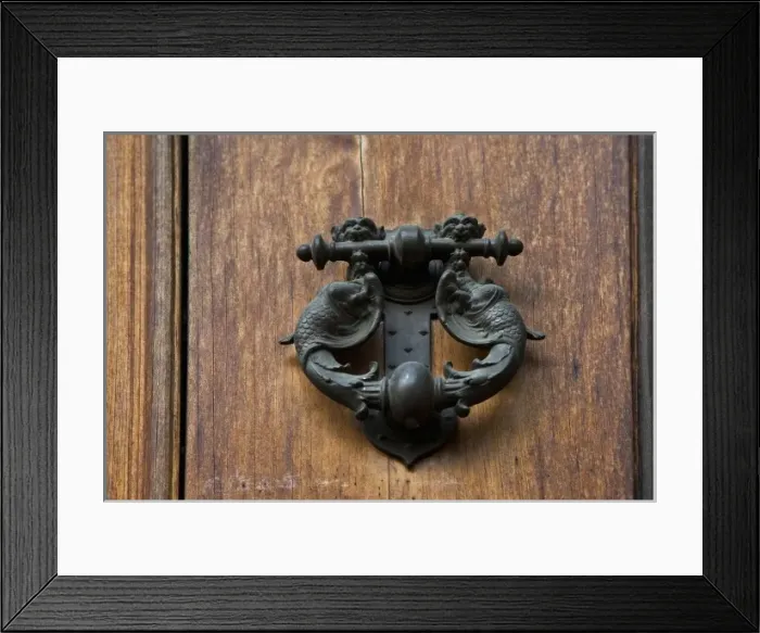 Framed Print : Sienna, Tuscany, Italy - Closeup of ornate, metal door knocker on a wooden door Framed Print : Sienna, Tuscany, Italy - Closeup of ornate, metal door knocker on a wooden door