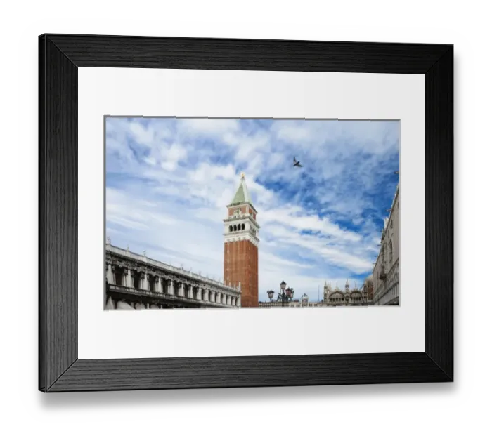 Framed Print : Venice, Veneto, Italy - A bird is flying in the sky above a plaza in a church courtyard Framed Print : Venice, Veneto, Italy - A bird is flying in the sky above a plaza in a church courtyard