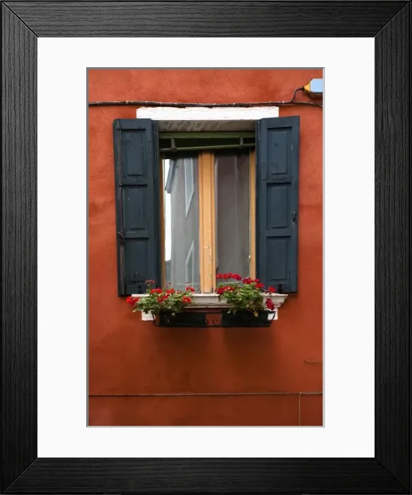Framed Print : Venice, Veneto, Italy - Black wooden shutters and flowers in a planter frame a window Framed Print : Venice, Veneto, Italy - Black wooden shutters and flowers in a planter frame a window