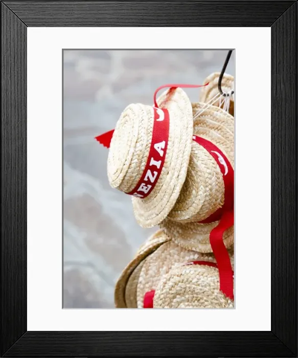 Framed Print : Venice, Veneto, Italy - Straw hats for sale to tourists are hanging from a hook