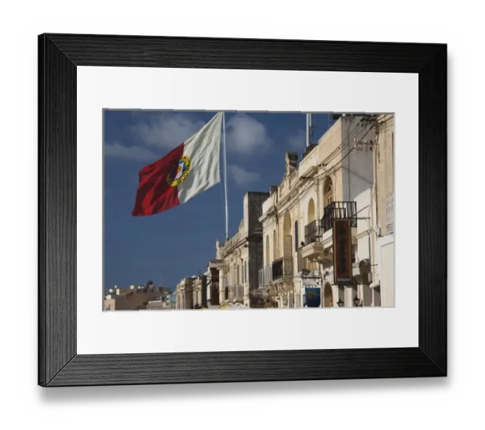 Framed Print : Malta, Southeast, Marsaxlokk, waterfront buildings and flag Framed Print : Malta, Southeast, Marsaxlokk, waterfront buildings and flag