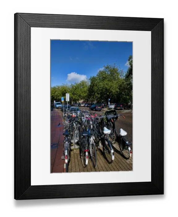 Framed Print : The importance of bicycles on a sunny day in Amsterdam, the Netherlands Framed Print : The importance of bicycles on a sunny day in Amsterdam, the Netherlands