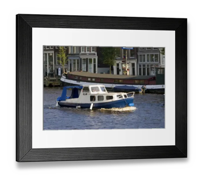 Framed Print : Canal boat on the Amstel River in Amsterdam, Netherlands Framed Print : Canal boat on the Amstel River in Amsterdam, Netherlands