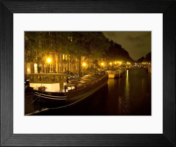 Framed Print : Boats docked at night along a canal near the Amstel River in Amsterdam, Netherlands Framed Print : Boats docked at night along a canal near the Amstel River in Amsterdam, Netherlands