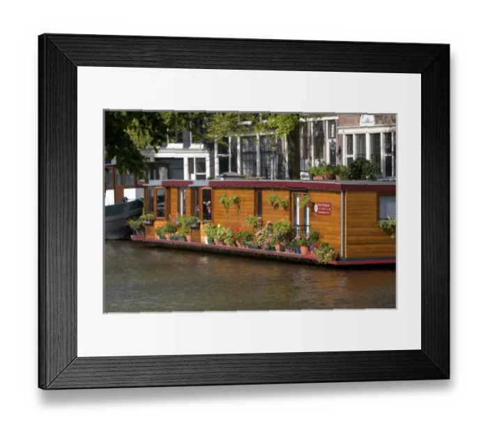 Framed Print : A houseboat docked on the Prinsengracht Canal in Amsterdam, Netherlands Framed Print : A houseboat docked on the Prinsengracht Canal in Amsterdam, Netherlands