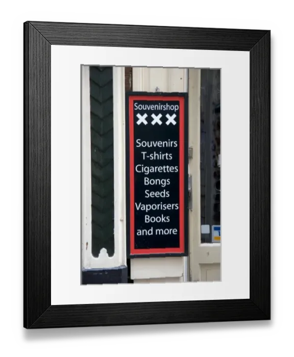 Framed Print : A business sign advertising the sale of marijuana accessories in Amsterdam, Netherlands