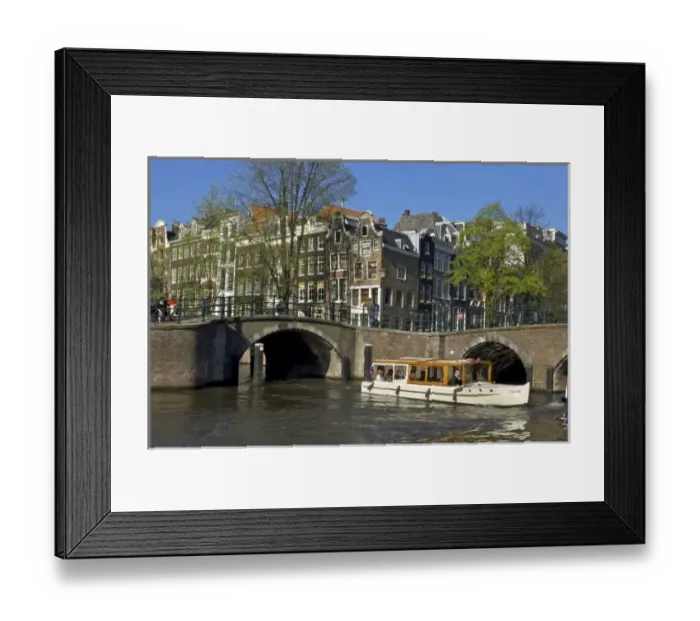 Framed Print : Europe, Netherlands, Holland, Amsterdam Tour boat at the intersection of Keizersgracht Framed Print : Europe, Netherlands, Holland, Amsterdam Tour boat at the intersection of Keizersgracht