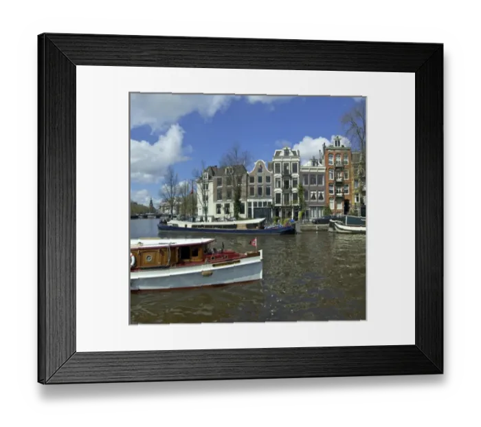 Framed Print : Netherlands, North Holland, Amsterdam, Canal boats at River Amstel and the Zwanenburgwal Framed Print : Netherlands, North Holland, Amsterdam, Canal boats at River Amstel and the Zwanenburgwal