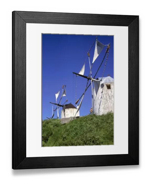 Framed Print : Europe, Portugal, Leiria. Windmill sails glides quietly in the breeze in the Leiria