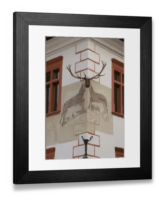 Framed Print : Painting and curving of an Elk in the old medieval city os Sighisoara. The notorious Vlad Tepes