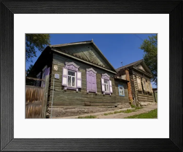 Framed Print : Old wooden worn house with colorful shutters in Irkutsk in Siberia Russia Framed Print : Old wooden worn house with colorful shutters in Irkutsk in Siberia Russia