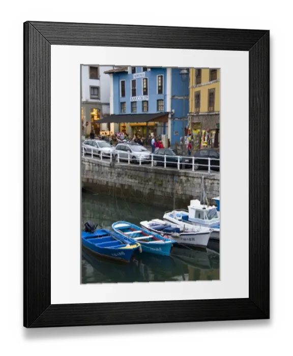 Framed Print : Harbor and storefronts at the fishing port of Llanes, Spain Framed Print : Harbor and storefronts at the fishing port of Llanes, Spain