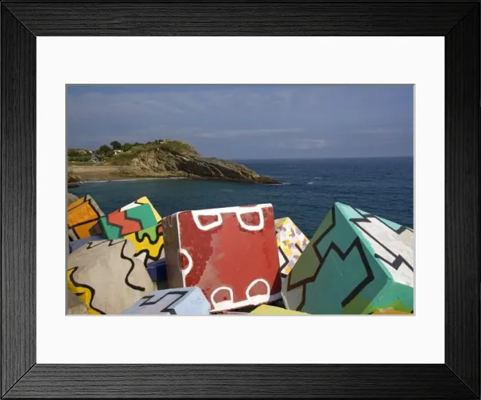Framed Print : Painted cement blocks in the harbor at Llanes, Spain Framed Print : Painted cement blocks in the harbor at Llanes, Spain
