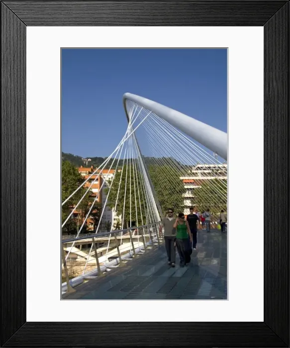 Framed Print : People walking across the Zubizuri Footbridge spanning the Nervion River in Bilbao Framed Print : People walking across the Zubizuri Footbridge spanning the Nervion River in Bilbao