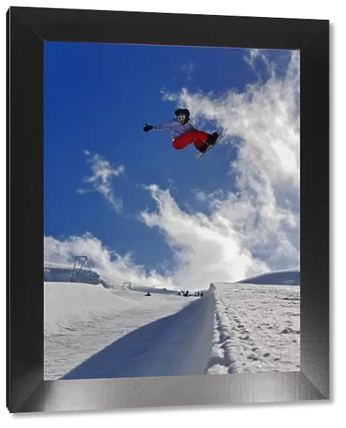 Snowboarder jumping in halfpipe, Klein Matterhorn, Zermatt, Switzerland, Model Released