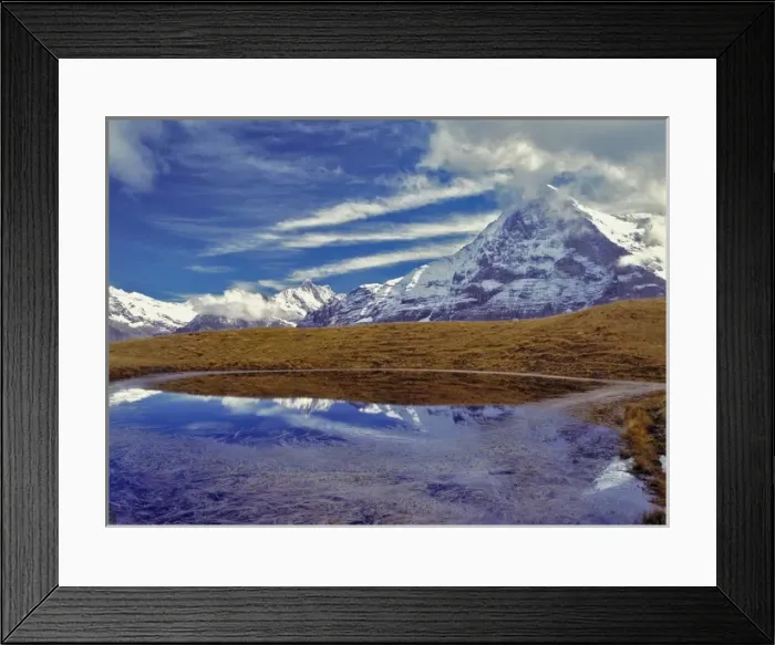 Framed Print : Europe, Switzerland, Eiger. The Eiger, a World Heritage Site, reflects in a small Framed Print : Europe, Switzerland, Eiger. The Eiger, a World Heritage Site, reflects in a small