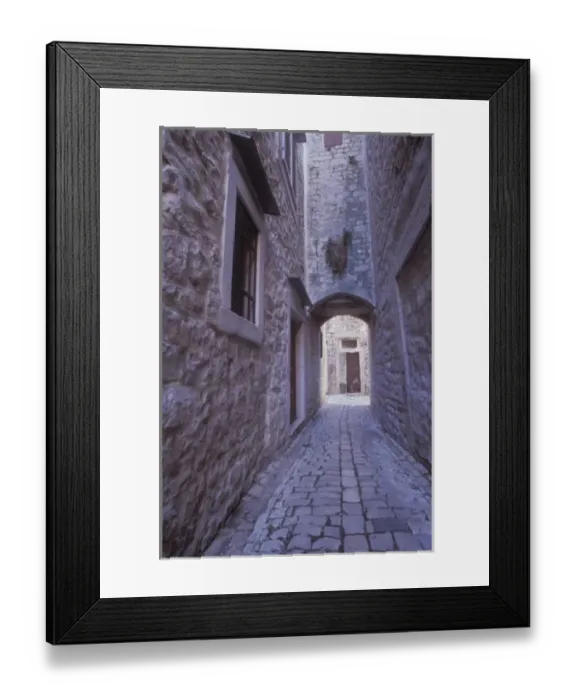 Framed Print : A narrow cobbled street in the back roads area of old town Trogir. Central Dalmatia