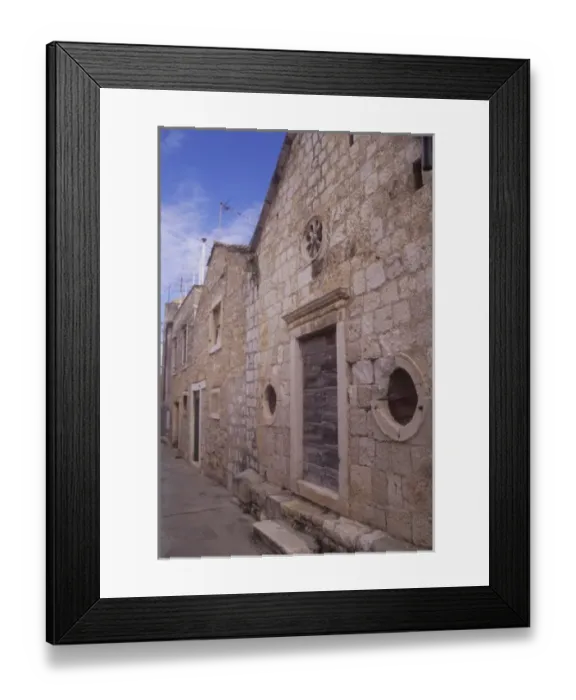 Framed Print : Building entryway and door detail along a narrow street. Vis town. Vis Island. Croatia