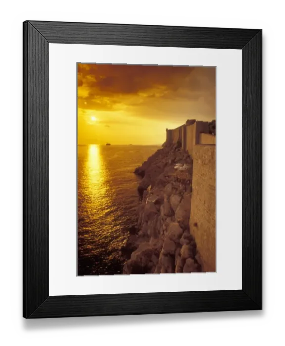 Framed Print : The sun is about to set over the Adriatic Sea outside the old city walls of Dubrovnik, Croatia Framed Print : The sun is about to set over the Adriatic Sea outside the old city walls of Dubrovnik, Croatia