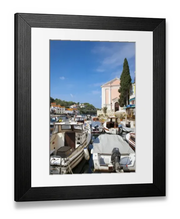 Framed Print : Cres, Coatia - High angle view of boats on a marina. Colorful buildings can be seen