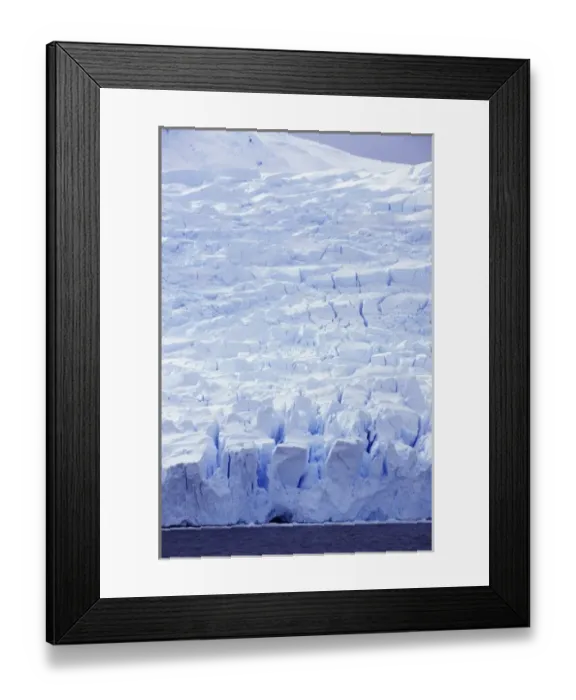 Framed Print : Enormous seracs cascade to the sea on a glacier near the entrance to Neko Harbor