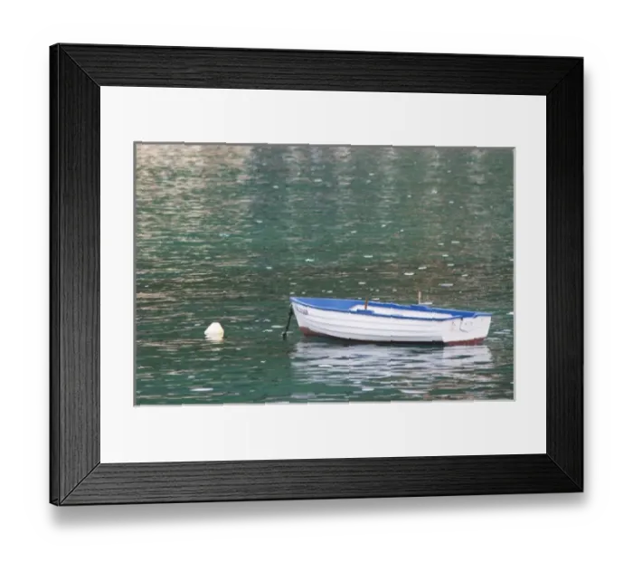 Framed Print : A white and blue rowing boat moored by a white buoy on a green sea. Uvala Sumartin Framed Print : A white and blue rowing boat moored by a white buoy on a green sea. Uvala Sumartin