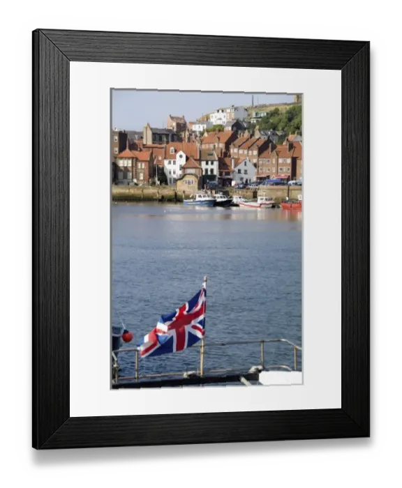 Framed Print : Harbor with fishing boats in the Harbor with Union Jack of beautiful tourist town