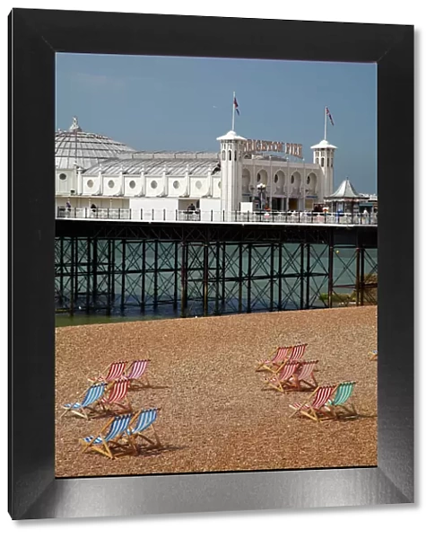 Brighton Pier (c. 1899), and beach chairs, Brighton, East Sussex, England