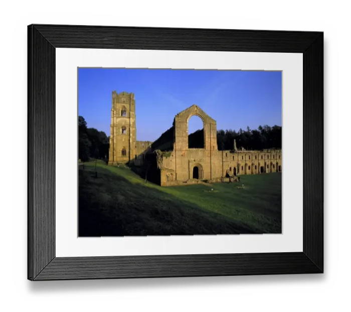 Framed Print : Europe, England, Fountains Abbey. Visitors roams among the stone ruins of Fountains Abbey