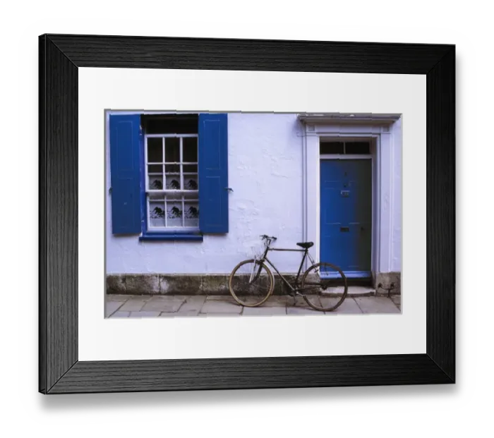 Framed Print : Europe, England, Oxfordshire. A bicycle leans against a white-washed home in Oxfordshire in England