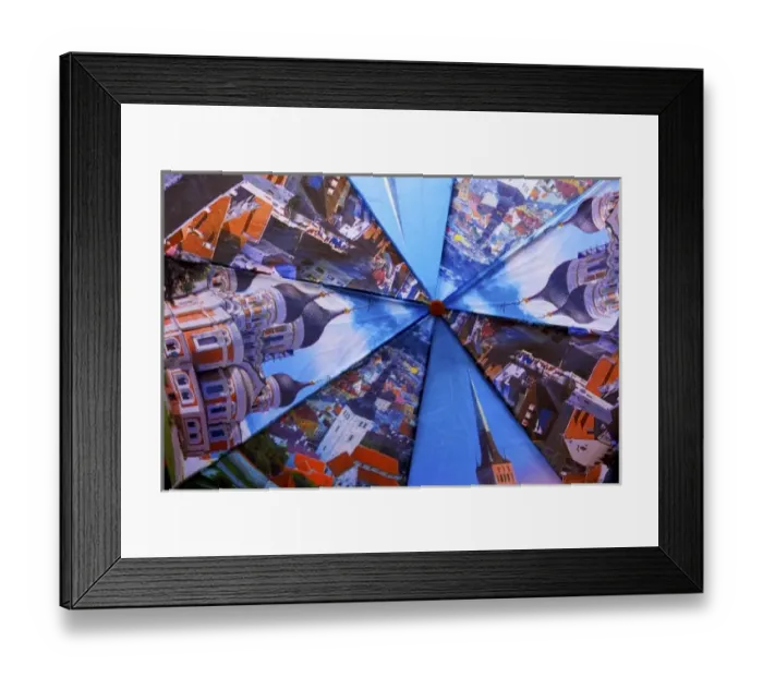 Framed Print : Estonia, Tallinn. Open umbrella showing city scenes in Tallinn