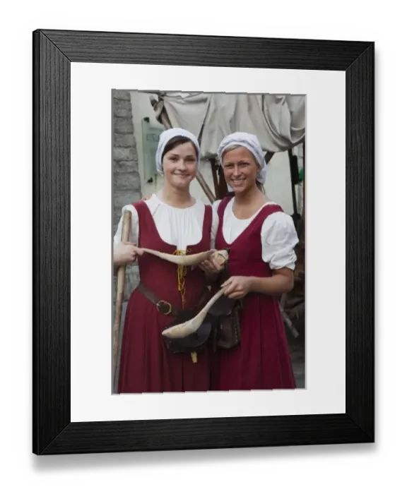 Framed Print : Estonia, Tallinn, Old Town, Raekoja Plats, Town Hall Square, young women in country costume Framed Print : Estonia, Tallinn, Old Town, Raekoja Plats, Town Hall Square, young women in country costume