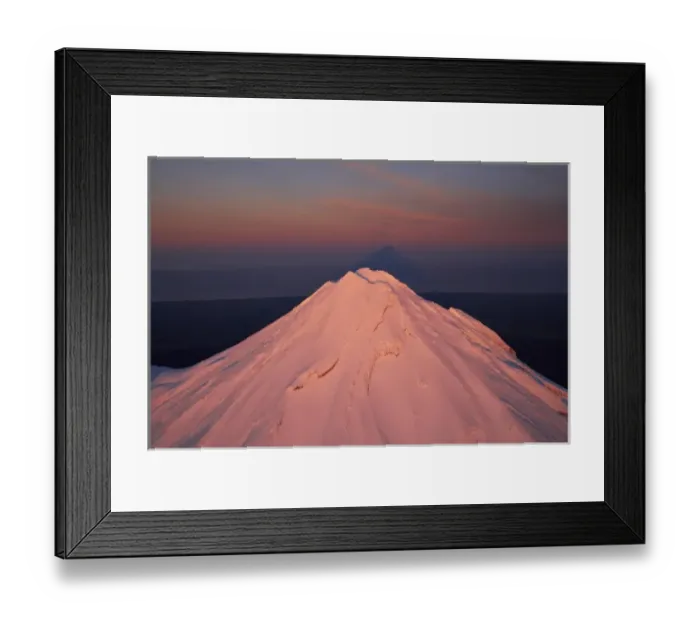 Framed Print : Alpenglow on Summit of Mt Taranaki / Mt Egmont at Dawn, and Shadow, Taranaki, North Island Framed Print : Alpenglow on Summit of Mt Taranaki / Mt Egmont at Dawn, and Shadow, Taranaki, North Island