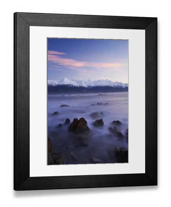 Framed Print : New Zealand, South Island, Kaikoura, Waves on Rocks and Seaward Kaikoura Range at Dawn