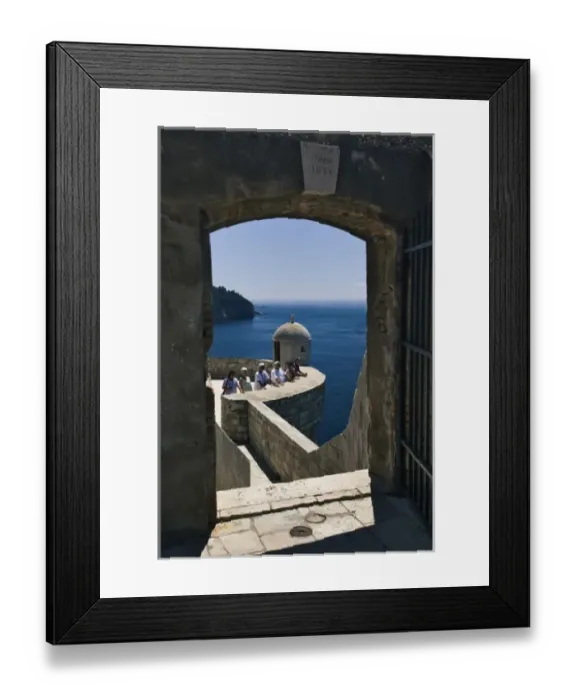 Framed Print : Adriatic Sea framed by gate on city wall around Old Town Dubrovnik, UNESCO World