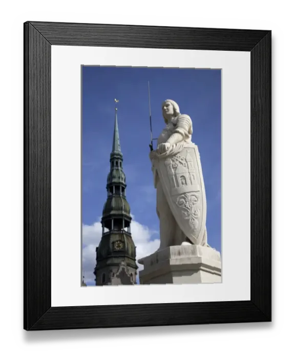 Framed Print : The statue of Roland in Town Hall Square with the tower of St. Peters Church in the background Framed Print : The statue of Roland in Town Hall Square with the tower of St. Peters Church in the background