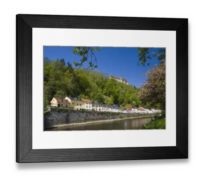 Framed Print : Luxembourg, Vianden. Town buildings and Vianden castle along Our River, morning Framed Print : Luxembourg, Vianden. Town buildings and Vianden castle along Our River, morning