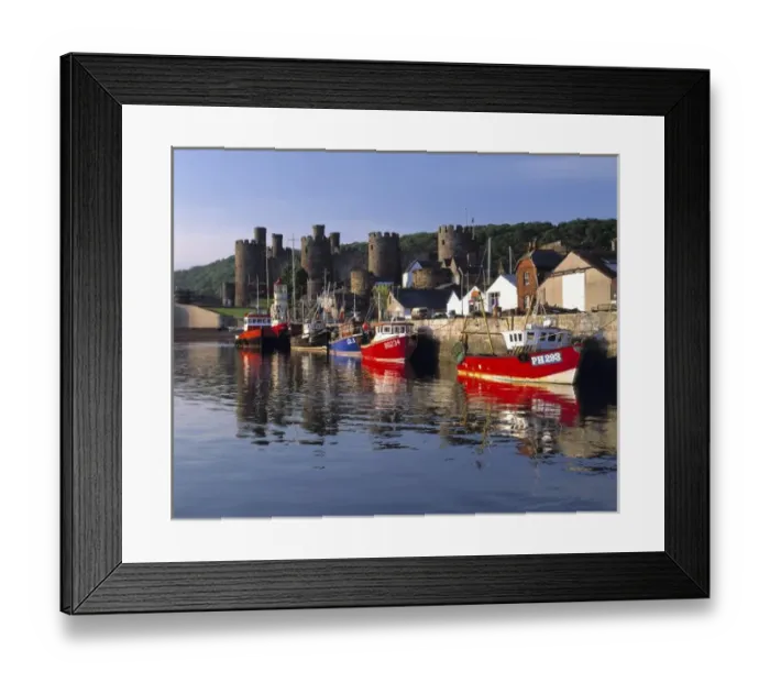 Framed Print : Wales, Conwy Co. Conwy. Fishing boats reflect iin the peaceful arbor near the Castle in Conwy Framed Print : Wales, Conwy Co. Conwy. Fishing boats reflect iin the peaceful arbor near the Castle in Conwy