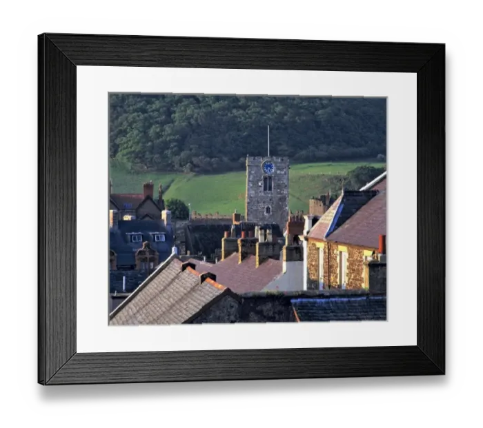 Framed Print : Wales, Conwy Co. Conwy. The sun highlights the steep roofs and the Clock Tower in Conwy, Conwy Co